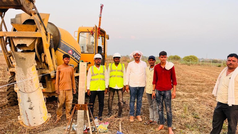 Yash Earthmovers site crew wearing helmets and high-visibility vests